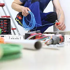 Person handling loose wires