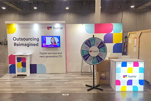 10x20 Trade Show Booth for TaskUs at Fintech Meetup, Designed and Build by Exponents in Las Vegas